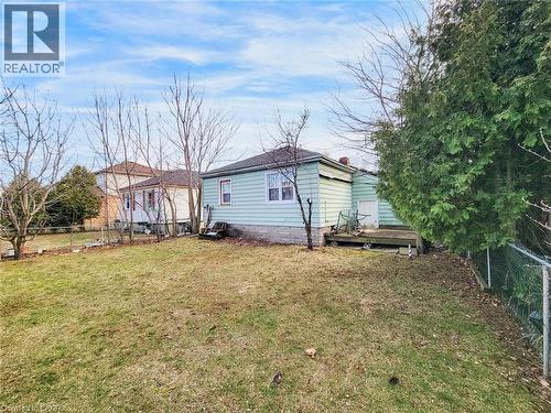 Back of property featuring a fenced backyard and a wooden deck - 823 Queensdale Avenue E, Hamilton, ON - Outdoor