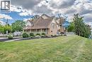 View of front of house with a shingled roof - 30 John Street, Port Dover, ON 