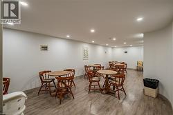 Dining space with recessed lighting and wood finished floors - 