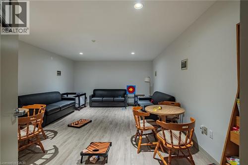 Living room featuring light wood-style floors and recessed lighting - 30 John Street, Port Dover, ON 