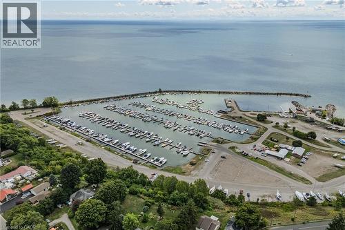 Drone / aerial view of numerous boat docks and a large body of water - 30 John Street, Port Dover, ON 