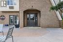 Property entrance featuring brick siding, a patio, and french doors - 30 John Street, Port Dover, ON 