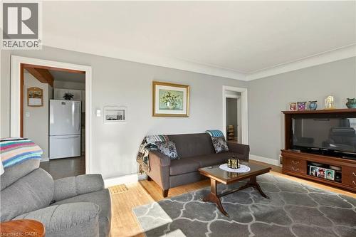 Living area with baseboards and light wood finished floors - 944 Garth Street, Hamilton, ON - Indoor Photo Showing Living Room