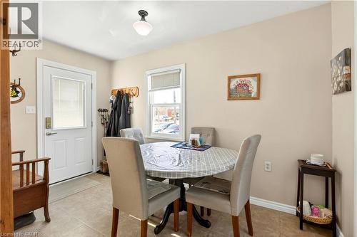 Dining space with light tile patterned floors - 944 Garth Street, Hamilton, ON - Indoor Photo Showing Dining Room