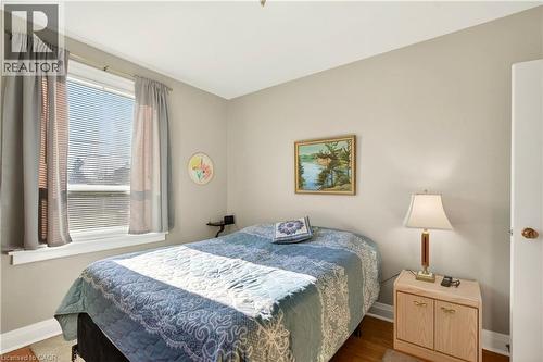 Bedroom with baseboards and wood finished floors - 944 Garth Street, Hamilton, ON - Indoor Photo Showing Bedroom
