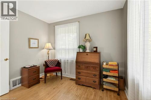 Sitting room featuring light wood-style flooring and baseboards - 944 Garth Street, Hamilton, ON - Indoor Photo Showing Other Room