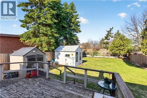 Wooden deck featuring a fenced backyard and a storage unit - 944 Garth Street, Hamilton, ON - Outdoor With Deck Patio Veranda