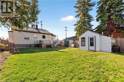 Back of house featuring a fenced backyard, a wooden deck, a shed, and a chimney - 944 Garth Street, Hamilton, ON - Outdoor