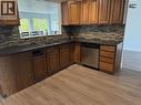 234 Centennial Drive, Mackenzie, BC  - Indoor Photo Showing Kitchen With Double Sink 