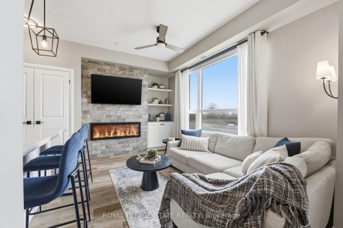 203-120 Springvalley Crescent, Hamilton, ON - Indoor Photo Showing Living Room With Fireplace