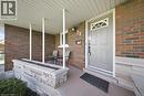 Covered front porch featuring a brick exterior and a stone planter box - 71 Pinecrest Drive, Kitchener, ON  - Outdoor With Deck Patio Veranda With Exterior 