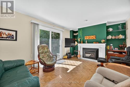 7 Maplecrest Road, Springwater, ON - Indoor Photo Showing Living Room With Fireplace