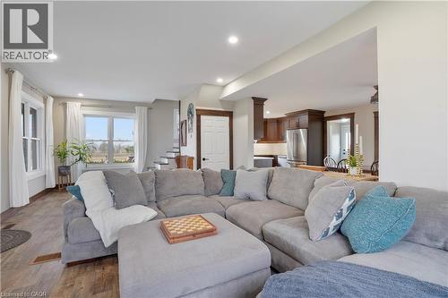 Living area featuring wood finished floors and recessed lighting - 23247 Beattie Line, Elgin, ON - Indoor Photo Showing Living Room