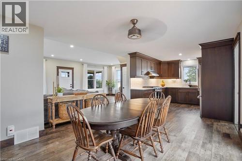 Dining room with a ceiling fan, dark wood-type flooring, and recessed lighting - 23247 Beattie Line, Elgin, ON - Indoor Photo Showing Dining Room