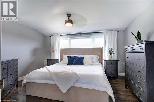Bedroom featuring dark wood finished floors, lofted ceiling, and ceiling fan - 23247 Beattie Line, Elgin, ON - Indoor Photo Showing Bedroom