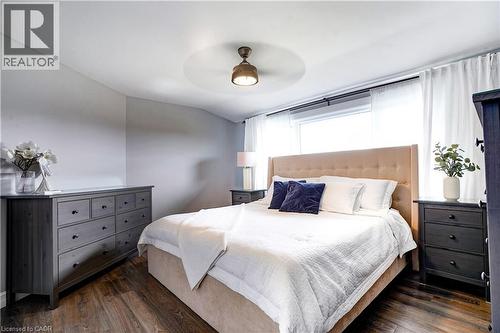Bedroom with dark wood finished floors, ceiling fan, and lofted ceiling - 23247 Beattie Line, Elgin, ON - Indoor Photo Showing Bedroom