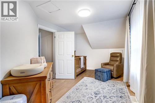 Living area with lofted ceiling and light wood-type flooring - 23247 Beattie Line, Elgin, ON - Indoor