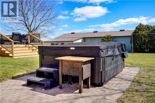 View of patio with a hot tub and a deck - 23247 Beattie Line, Elgin, ON - Outdoor With Deck Patio Veranda With Exterior