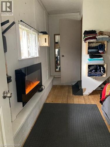 37C Cedar Drive, Turkey Point, ON - Indoor With Fireplace