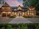 Stone and wood-shingle exterior featuring a prominent gabled entrance - 140 Secord Lane, Burlington, ON  - Outdoor With Facade 