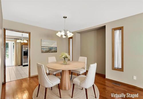 Virtually staged dining area - 37 Optimist Way, Winnipeg, MB - Indoor Photo Showing Dining Room