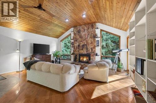 7905 97A Highway, Mara, BC - Indoor Photo Showing Living Room With Fireplace