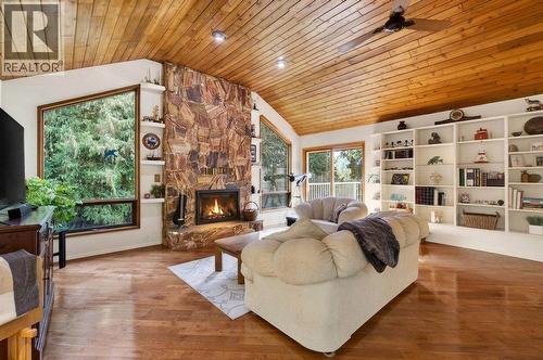 7905 97A Highway, Mara, BC - Indoor Photo Showing Living Room With Fireplace