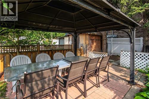 Fenced backyard with a gazebo, outdoor dining area, and a patio - 129 River Road E, Kitchener, ON - Outdoor With Deck Patio Veranda