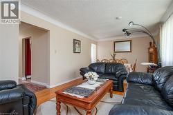 Living area with wood finished floors and a textured ceiling - 