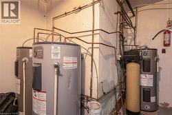 Utility room with electric water heater - 