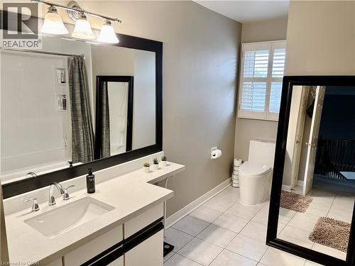 Full bathroom featuring vanity, light tile patterned floors, and shower / tub combo - 2056 Hadfield Court, Burlington, ON - Indoor Photo Showing Bathroom
