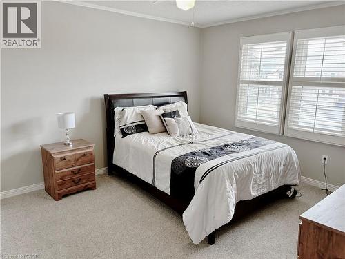 Bedroom with light carpet, ornamental molding, and a ceiling fan - 2056 Hadfield Court, Burlington, ON - Indoor Photo Showing Bedroom
