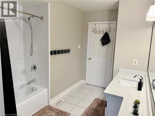 Bathroom with vanity, shower / washtub combination, and light tile patterned floors - 2056 Hadfield Court, Burlington, ON - Indoor Photo Showing Bathroom