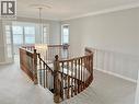 Corridor featuring a chandelier, an upstairs landing, carpet floors, and ornamental molding - 2056 Hadfield Court, Burlington, ON  - Indoor Photo Showing Other Room 