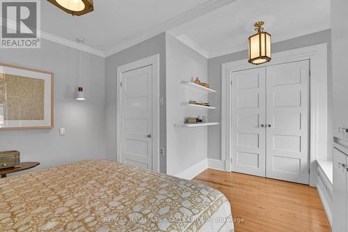 Primary Bedroom with Built-in Shelving - 280 Flora Street, Ottawa, ON - Indoor Photo Showing Bedroom