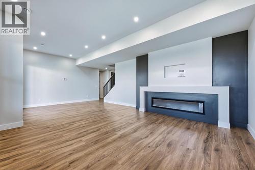 1120 Collinson Court, Kelowna, BC - Indoor Photo Showing Other Room With Fireplace