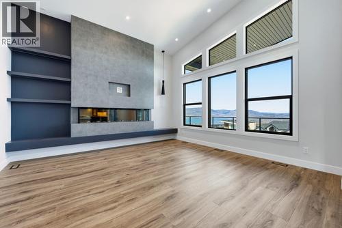 1120 Collinson Court, Kelowna, BC - Indoor Photo Showing Other Room With Fireplace