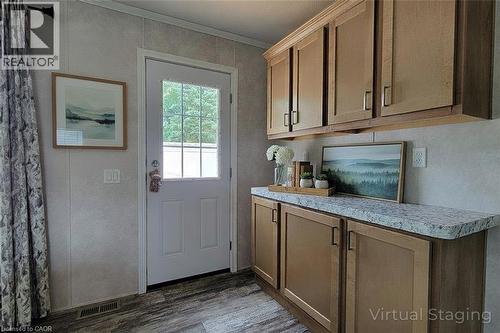 Entryway with wood finished floors and crown molding - 77 Park Lane, Flamborough, ON - Indoor Photo Showing Kitchen