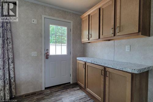 Entryway with dark wood-style floors and ornamental molding - 77 Park Lane, Flamborough, ON - Indoor
