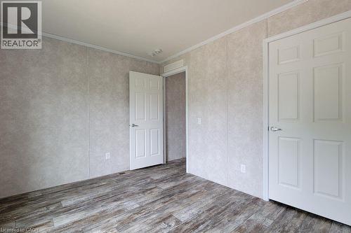 Unfurnished room with wood finished floors and ornamental molding - 77 Park Lane, Flamborough, ON - Indoor Photo Showing Other Room