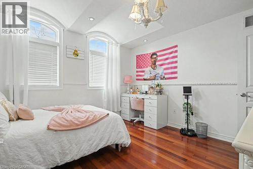 Bedroom with a chandelier, dark wood-style floors, and vaulted ceiling - 284 Normanhurst Avenue, Hamilton, ON - Indoor Photo Showing Bedroom