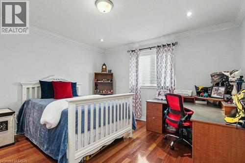 Bedroom featuring an office area, crown molding, dark wood-style floors, and recessed lighting - 284 Normanhurst Avenue, Hamilton, ON - Indoor Photo Showing Bedroom