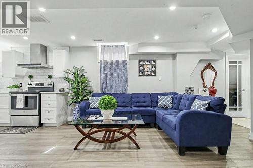 Living area featuring light wood-style floors and recessed lighting - 284 Normanhurst Avenue, Hamilton, ON - Indoor Photo Showing Living Room