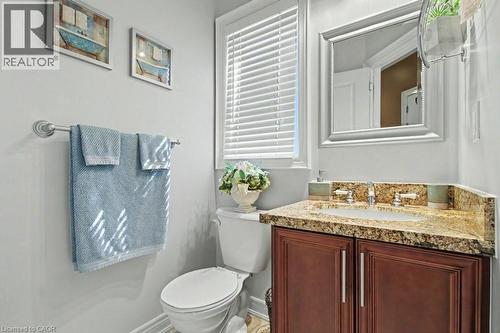 Half bathroom featuring toilet and vanity - 284 Normanhurst Avenue, Hamilton, ON - Indoor Photo Showing Bathroom