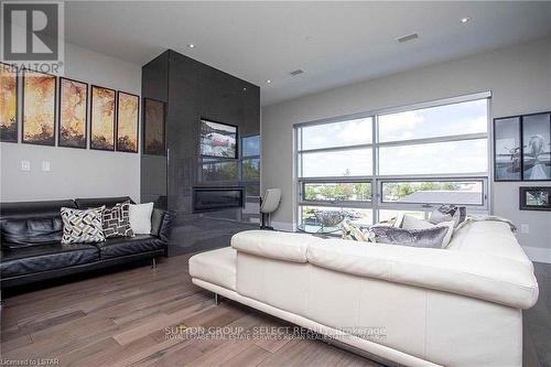 208 - 1705 Fiddlehead Place, London North (North R), ON - Indoor Photo Showing Living Room With Fireplace