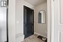 Entrance foyer with light wood-style flooring and baseboards - 120 Springvalley Crescent Unit# 203, Hamilton, ON  - Indoor Photo Showing Other Room 