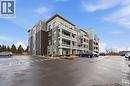 View of apartment building / complex with uncovered parking - 120 Springvalley Crescent Unit# 203, Hamilton, ON  - Outdoor With Balcony With Facade 