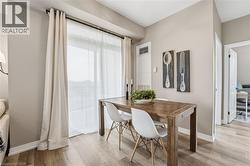 Dining space featuring baseboards and light wood finished floors - 