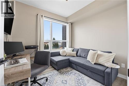Office area featuring wood finished floors and baseboards - 120 Springvalley Crescent Unit# 203, Hamilton, ON - Indoor Photo Showing Living Room