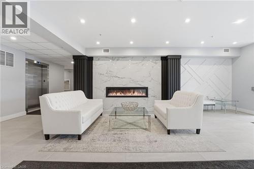 Building lobby with recessed lighting - 120 Springvalley Crescent Unit# 203, Hamilton, ON - Indoor With Fireplace